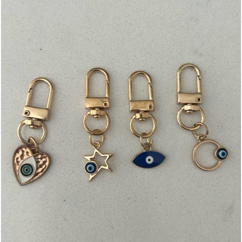 Set of 4 gold colored evil eye keychains